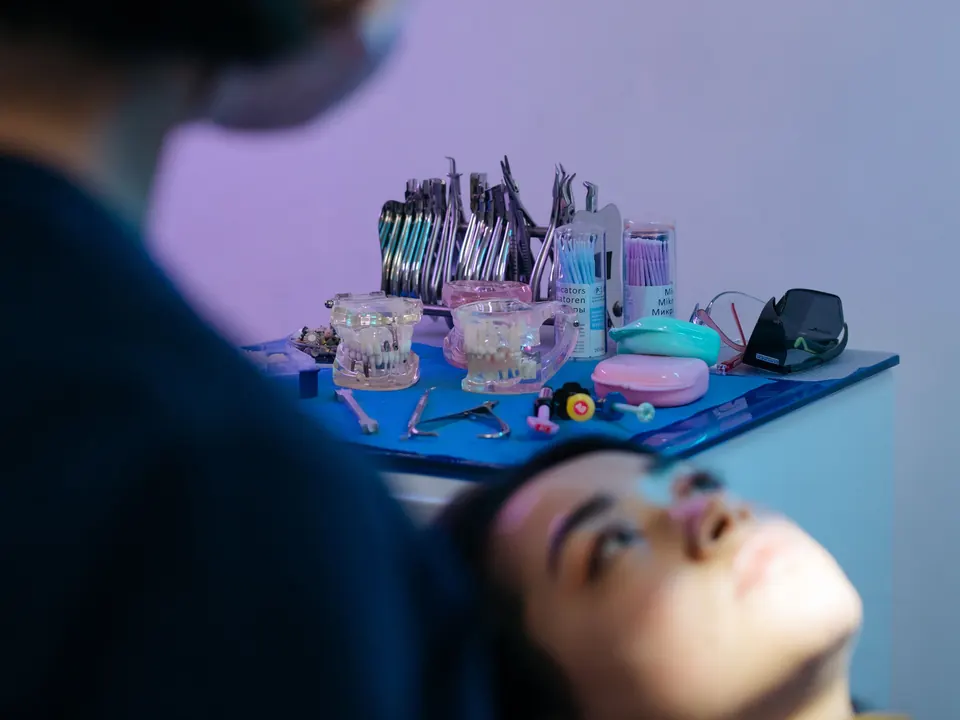 Clinical assistant preparing an orthodontic treatment room